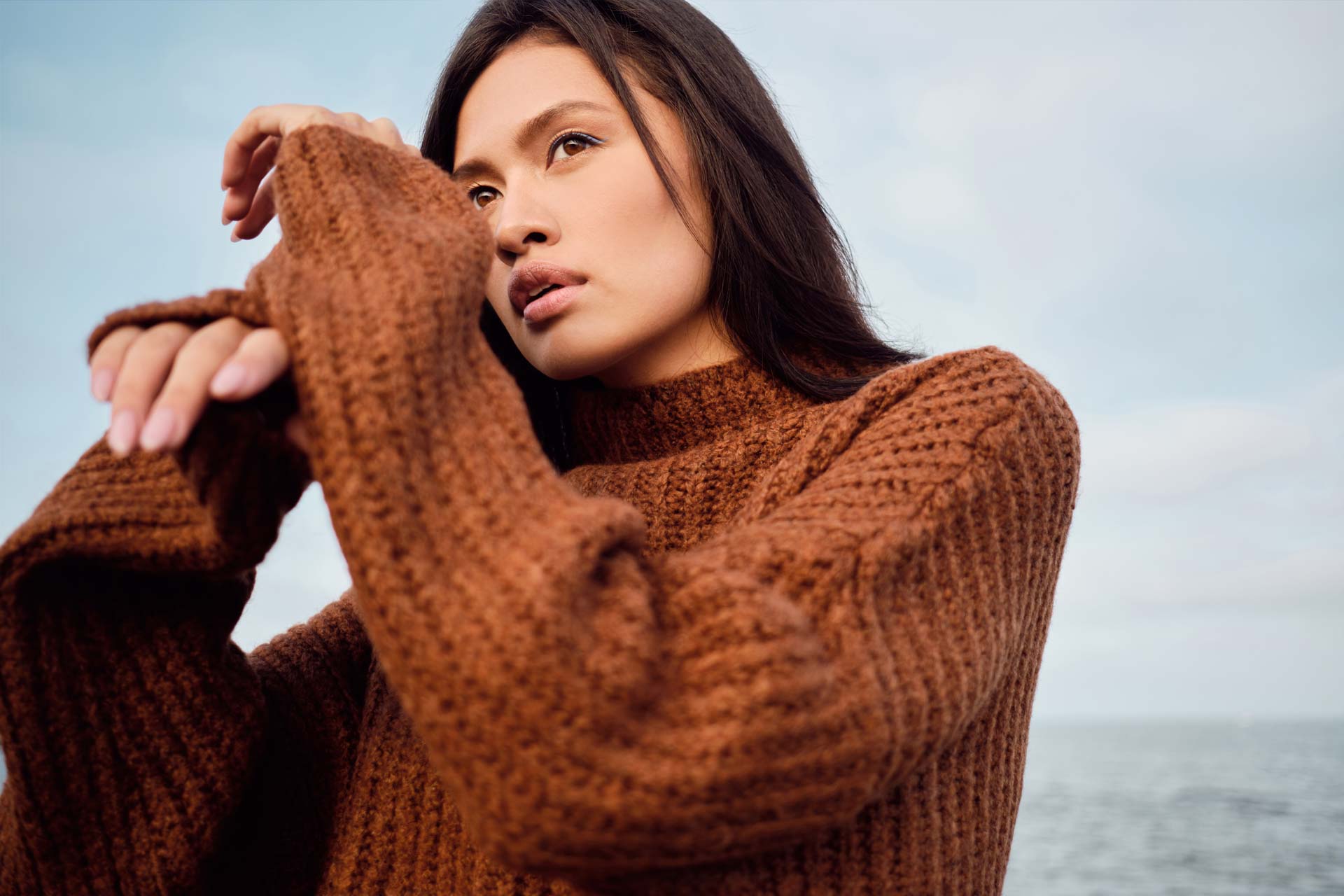 beautiful-asian-brunette-girl-in-cozy-knitted-JXDH6Q7.jpg